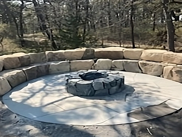Stone outdoor fire pit built for a customer in Mashpee, MA. Designed by Cape Cod Hardscapes