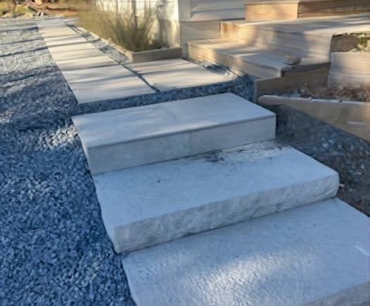 Stone steps from a house in Dennis, MA. Designed by Cape Cod Hardscapes