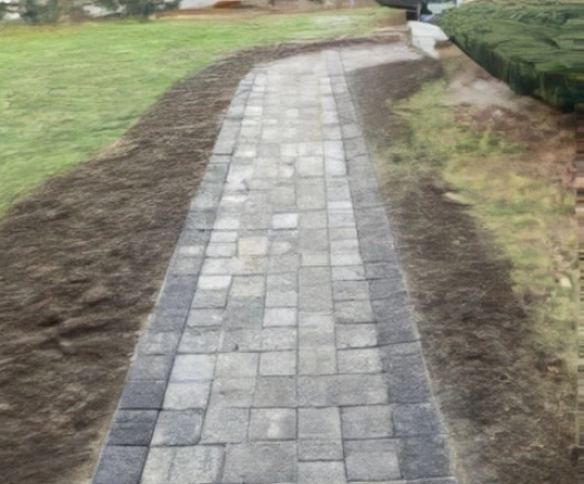 Reclaimed Cobblestone walkway from a house in Falmouth, MA. Designed by Cape Cod Hardscapes